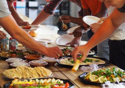 Team lunch catered by Hiba Express - everyone tucking in